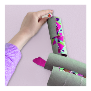 Wall marble run from cardboard tubes and tape - Willy Wonka-inspired Make-Believe STEM Science Experiments