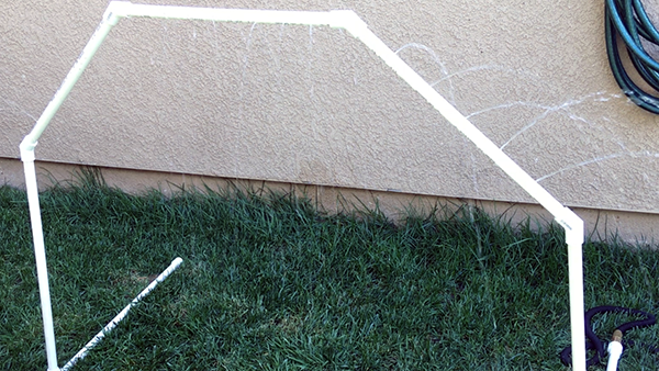Example of a backyard water sprinkler made from PVC pipes.