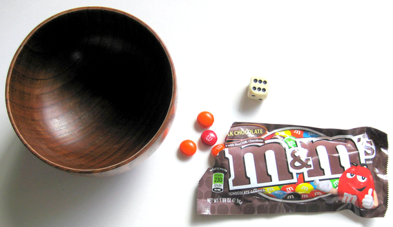 Bowl, die, and bag of candies uses for autoimmune disease probability activity