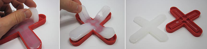 Three photos show cured silicon being pulled from a red cross-shaped mold