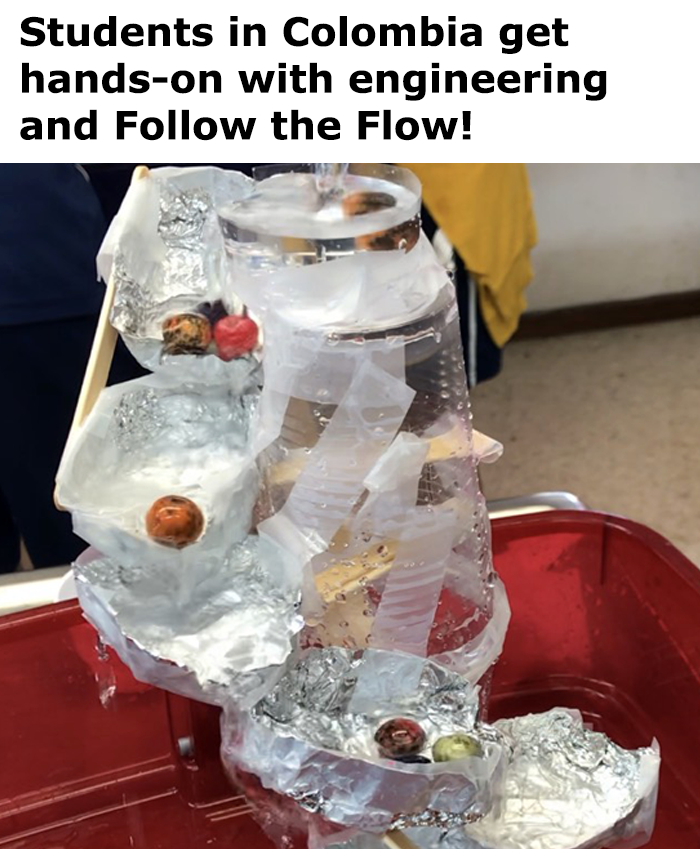 A terraced waterfall made from plastic cups, aluminum foil, popsicle sticks and tape