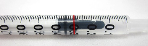 A plastic syringe is filled with water to the 0.3 mL mark
