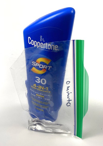 A resealable plastic bag with one corner cut off and containing 10mL of water. 