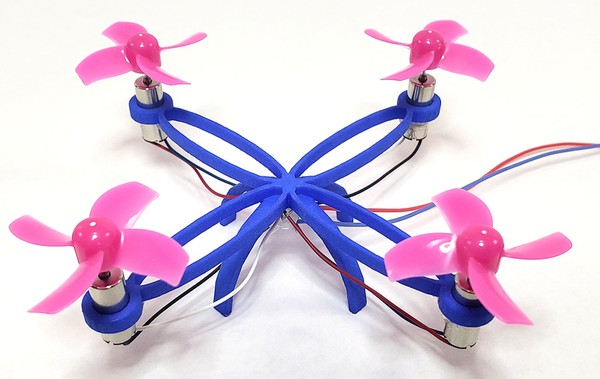 3D printed mini drone with propellers and motors attached 