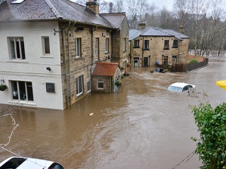 flooded building and car