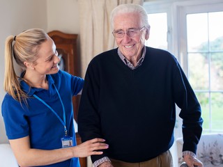 healthcare worker with elderly man