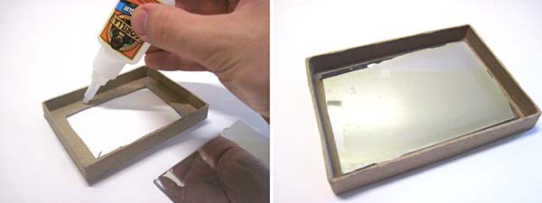A plexiglass mirror is glued to the inside of a box lid with the mirror side facing inward