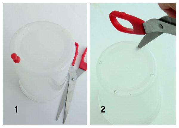Scissors are used to create four evenly spaced holes along the base of a plastic cup