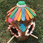 Bird feeder made from recycled plastic bottle and decorated with craft materials