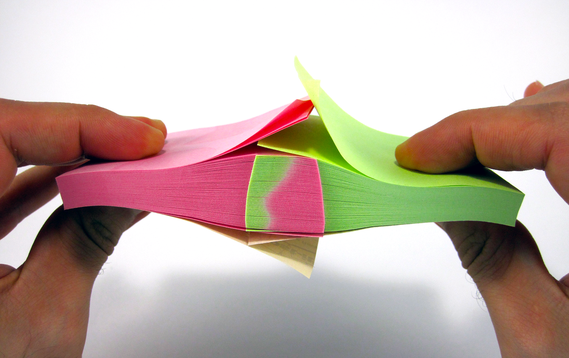 Two sticky notepads interleaved