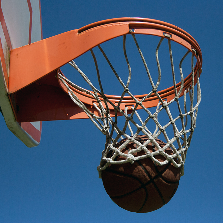 Basketball going through hoop