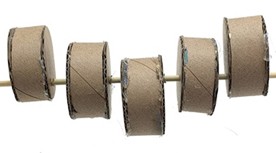  Side view of 5 short cylinders threaded onto a skewer. The cylinders  are mounted such that their tops form a wide V shape. 