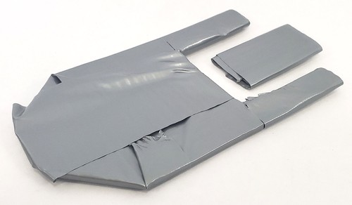 Cardboard paddle boat covered in duct tape.