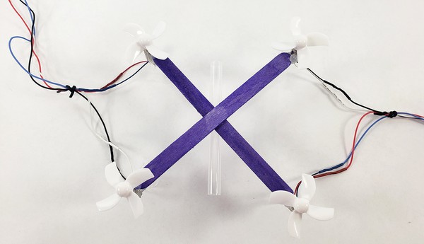  Drone with motor wires bundled on each side and straw attached to middle
