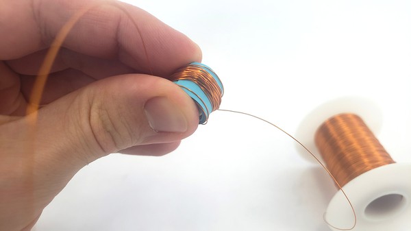 coil of wire around paper tube 