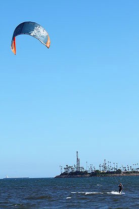A person kite surfing on the water