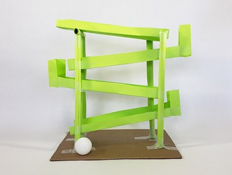 A switchback ball run built from paper and tape 