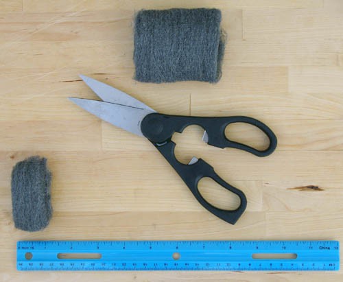 Cutting a 1-in strip of wool pad