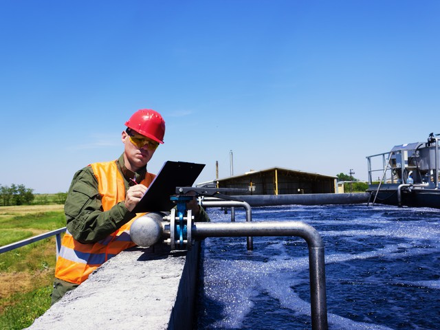 person checking water treatment facility