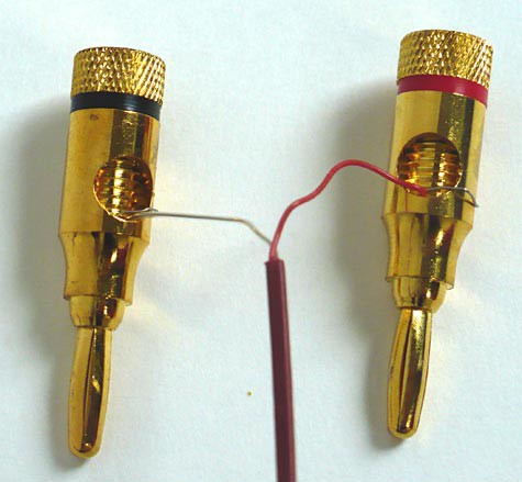 Two thermocouple leads each attach to a banana plug