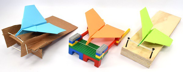 Paper airplane launchers made from different materials