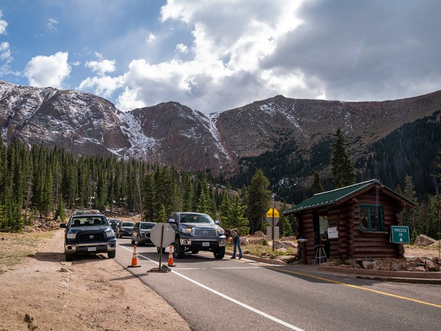 ranger at break check station before steep mountain pass