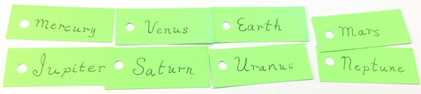 Illustration of eight name tags, one for each planet