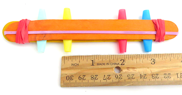 Harmonica made from craft sticks, straws, and rubber bands