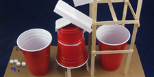 A marble sorting machine made from popsicle sticks, paper and plastic cups