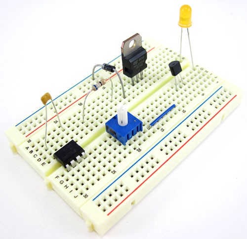 Various electronic components plugged into a half-sized breadboard
