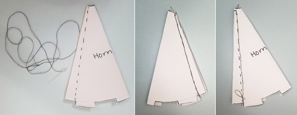 Needle threaded with normal thread for horn. The back of the horn that is stitched. The front of the horn that is stitched. 