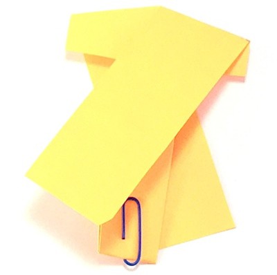 Folded whirlybird with a paperclip holding the bottom flap in place.