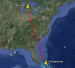 A red line connects two pins from Michigan to the Bahamas on a map within Google Earth