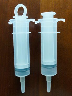 Two plastic syringes