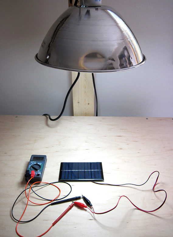 physics experiments electricity Solar cell setup with overhead light