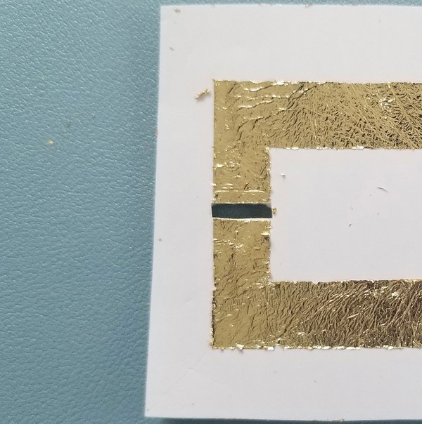 The small rectangular strip cut for LED on the metal leaf and temporary tattoo backing. 