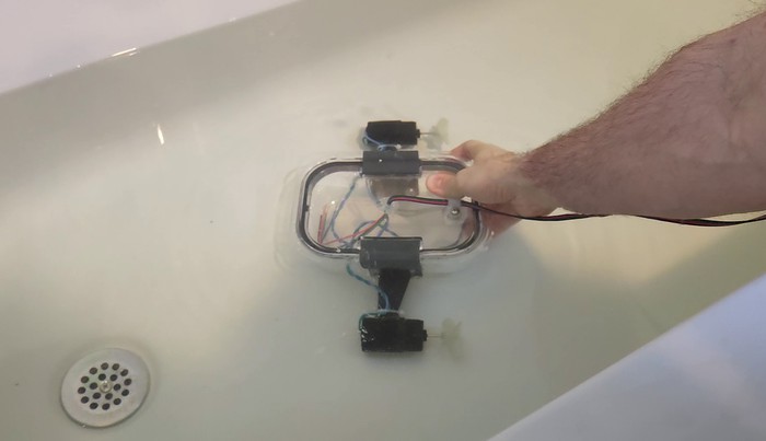 The ROV with electronics removed submerged in a bathtub 