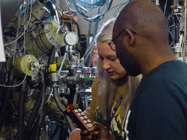 Experimental physicists in a lab