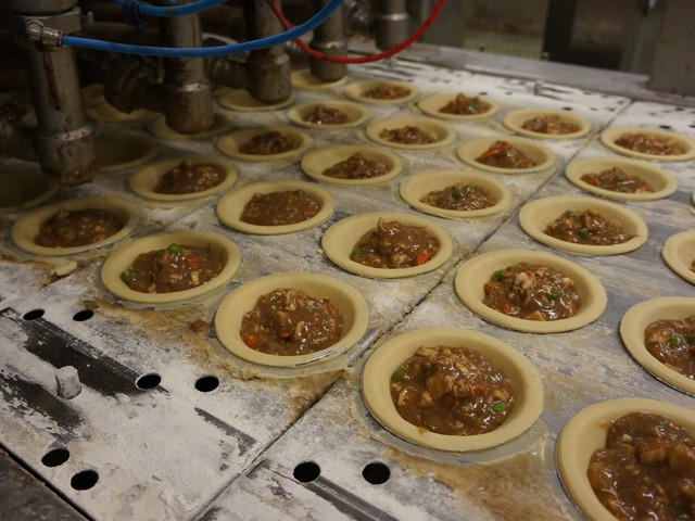lineup of pies in  manufacturing 