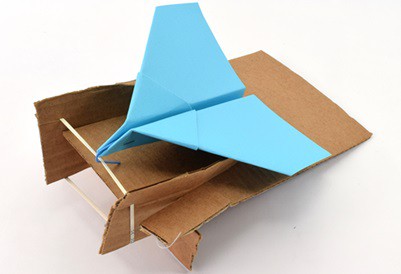 Paper airplane launcher made from cardboard and rubber band