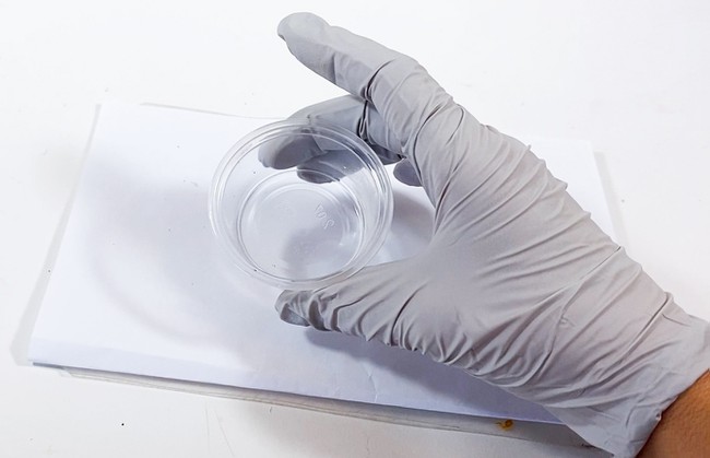 Reactants mixed into a plastic cup