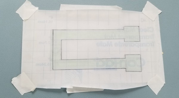 The final template shape outline drawn on Con-Tact paper. 