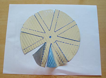 Drawing of eight flaps cut into a circle