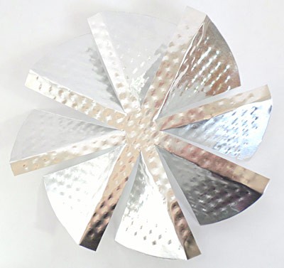 A windmill with angled blades made from the bottom of an aluminum pie pan