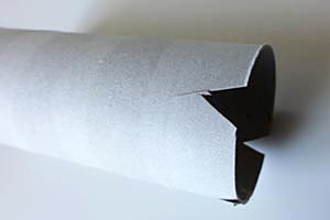 A paper tube with cut out notches across of each other
