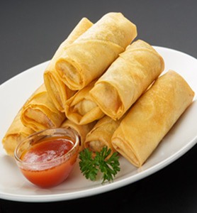 Spring rolls presented on a white plate 