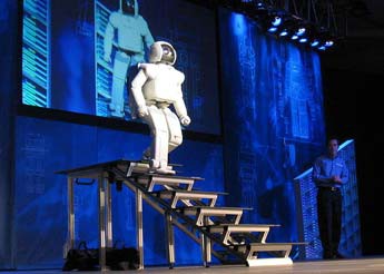 A humanoid robot walking down a set of stairs