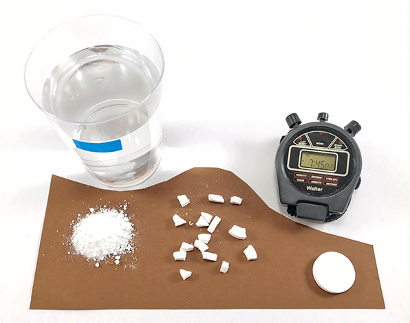 Materials for an activity exploring the relationship between surface area and reaction rate -- a stop watch, tablets crushed in different sizes, and water