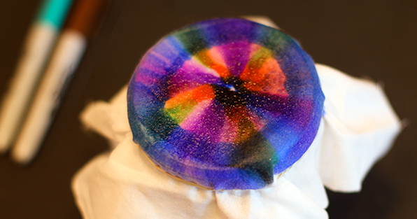 Marker tie-dye on fabric over a jar opening