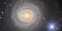 Hubble Captures a Bright Galactic and Stellar Duo